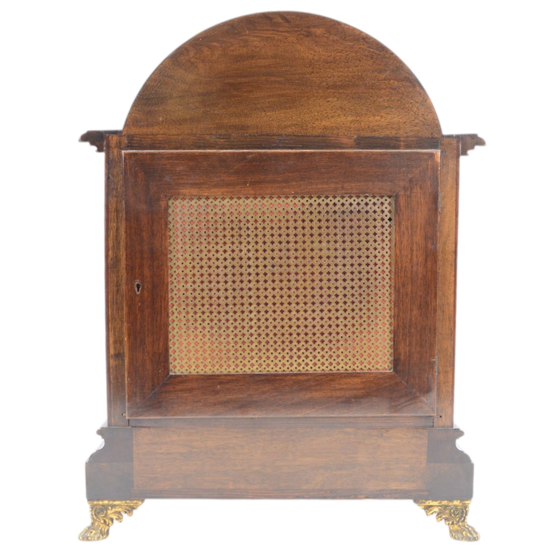 Winterhalder and Hoffmeier - German 8-day three train Edwardian oak cased mantle clock, with a break arch pediment, brass sound frets to the sides and conforming glazed door beneath, with flanking reeded pilasters on a stepped plinth raised on paw feet, sheet brass dial with fretted spandrels and matted dial centre, silvered chapter with Roman numerals, gothic steel hands and subsidiary dials for pendulum regulation and chime select, going barrel movement, chiming the quarters and striking the hours on nine coiled steel gongs. With pendulum and keys.