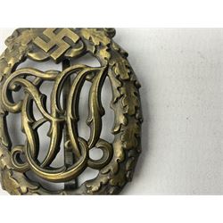 Two WW2 German Sports badges - SA sports badge marked verso 'W.Redo Eigentum D. Obersten SA. Fuhrung Saar Lautern'; and DRL sports badge marked verso 'Wernstein Jena D.R.G.M. 35269' (2)