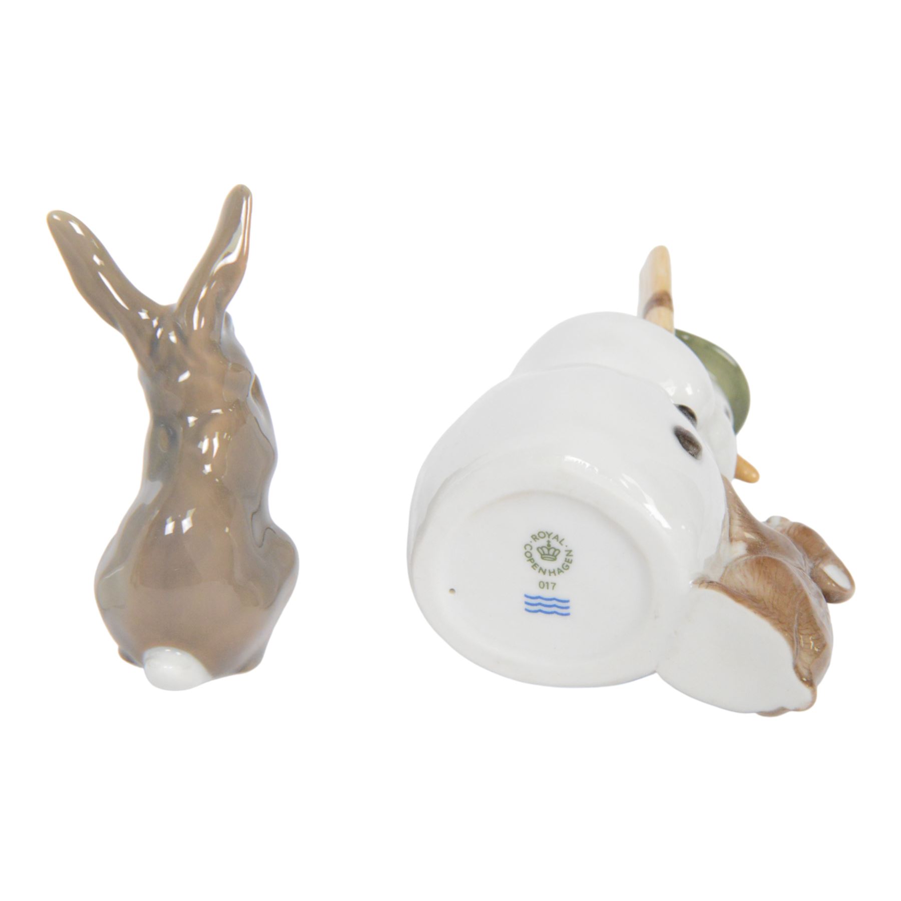 Royal Copenhagen, five figures including Owl 155, Snowman 017, Rabbit 154 etc, together with Royal Dux cockatoo