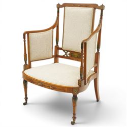 Pair of Victorian Sheraton Revival painted satinwood armchairs, the cresting rail painted with trailing floral bouquets flanked by illusion arcade motifs, over a cameo back and sides with acanthus painted swell-turned uprights, the lower back rail decorated with a bird scene and flanking pierced foliate design, upholstered in ivory fabric, raised on turned supports with further acanthus leaf paintwork, terminating to brass castors