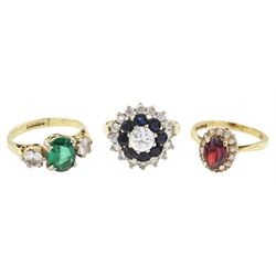 Three gold stone set rings including garnet, cubic zirconia and sapphire, all hallmarked 9ct