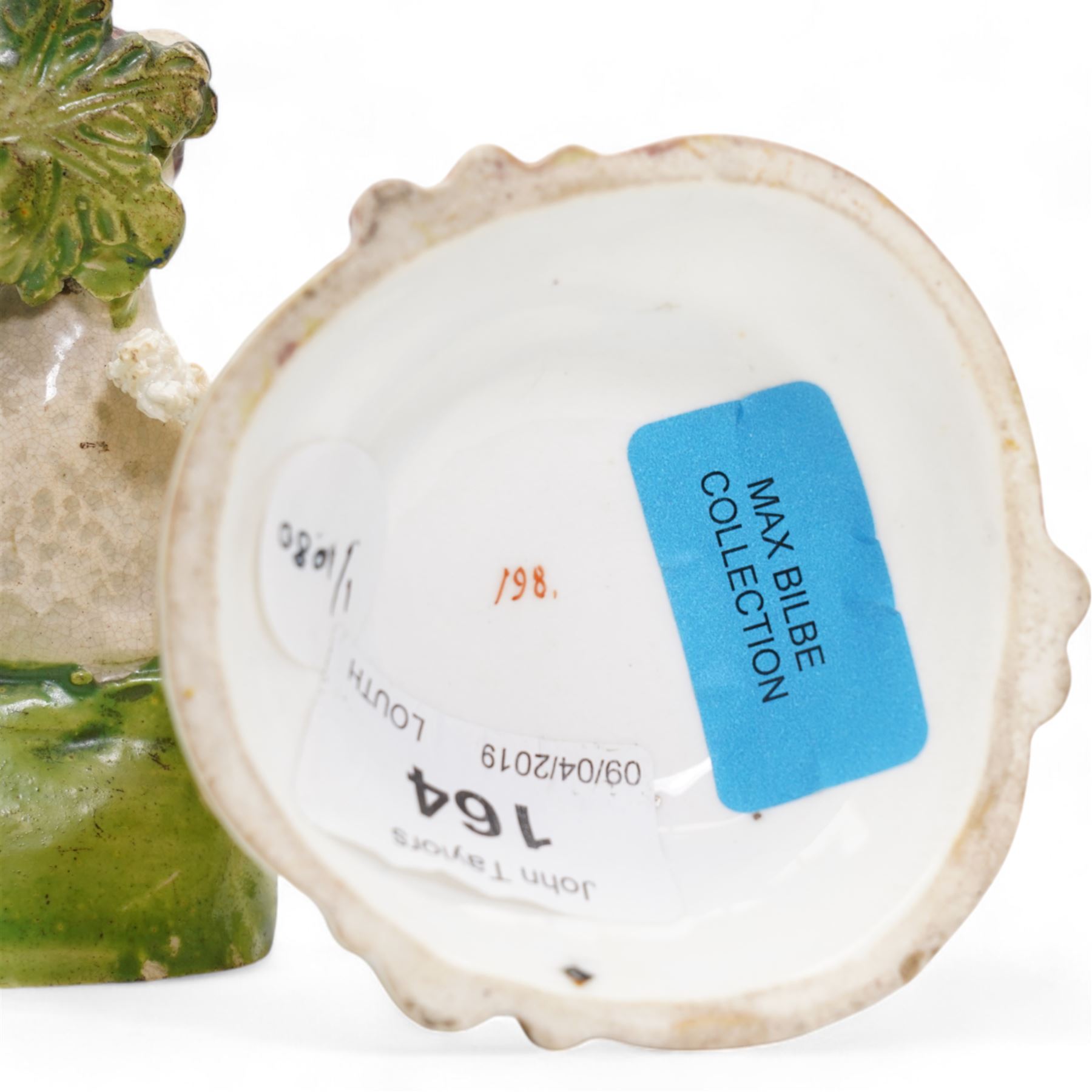 Early 19th century Staffordshire pearlware group by Ralph Salt, modelled as a sheep and lamb before a flowering bocage, impressed 'Salt' verso, H16cm, pair of similar Staffordshire pearlware sheep and ram and poodle group, numbered 198 beneath, with 'Max Bilbe Collection' label (4)