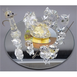  Collection of Swarovski crystal models incl. an Elephant, boxed,  Cat, Swans, Owl, Pig, Mouse on circular mirror stand (12)  