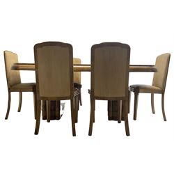 Early 20th century Art Deco walnut twin pedestal dining table, shaped top with thick crossbanding over a rounded edge, raised on two shaped pedestals (W187cm D107cm H76cm); and set of six matching dining chairs, the high back and sprung drop-in seat upholstered in walnut effect faux leather with reeded apron, raised on square supports (W47cm H97cm)