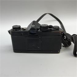 Olympus OM2 camera, 'no.264258', fitted with Olympus 'OM System G.Zuiko Auto-W 1:2.8 f35mm' lens and two other lenses, in a carry case