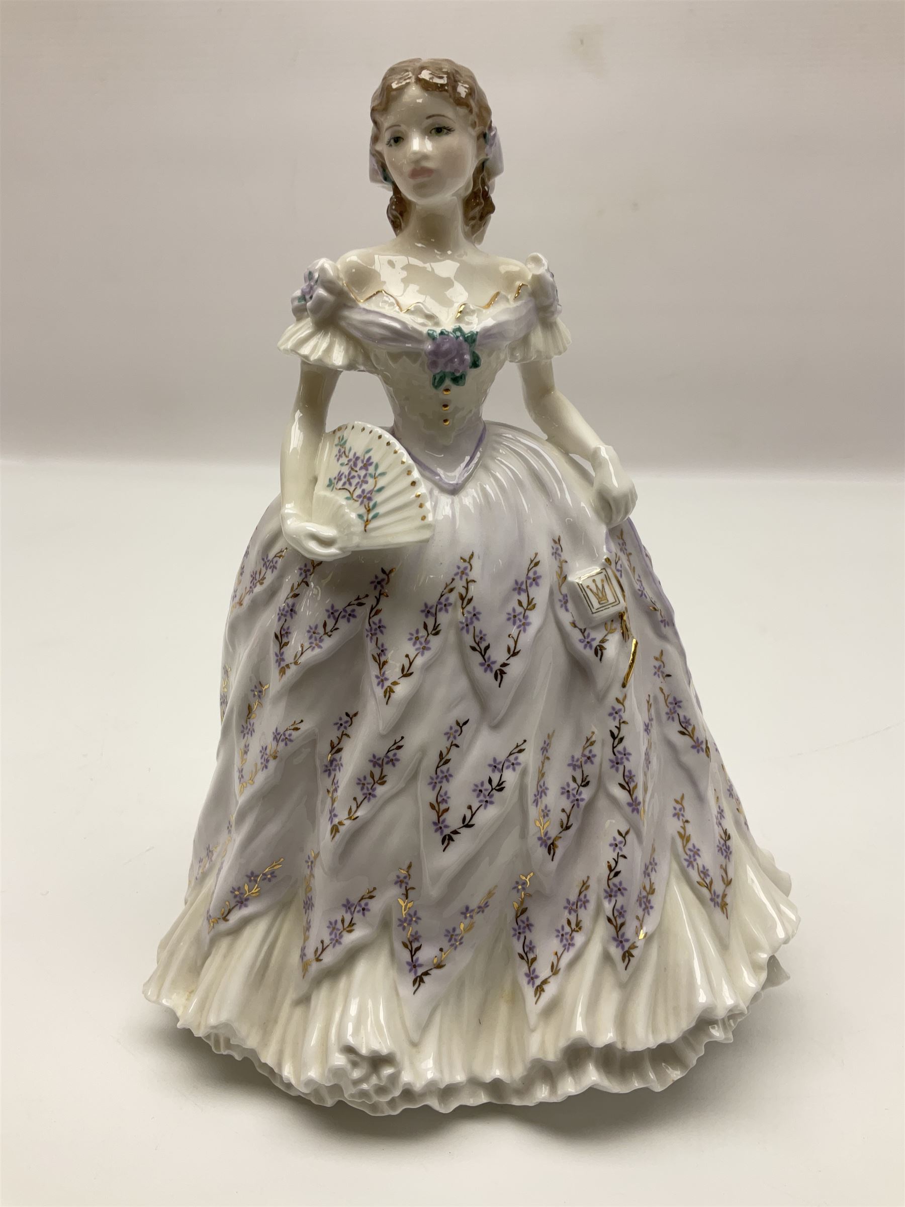 Three Coalport figures, comprising Eugenie, Lillie Langtry and Laura, together with seven other similar figures