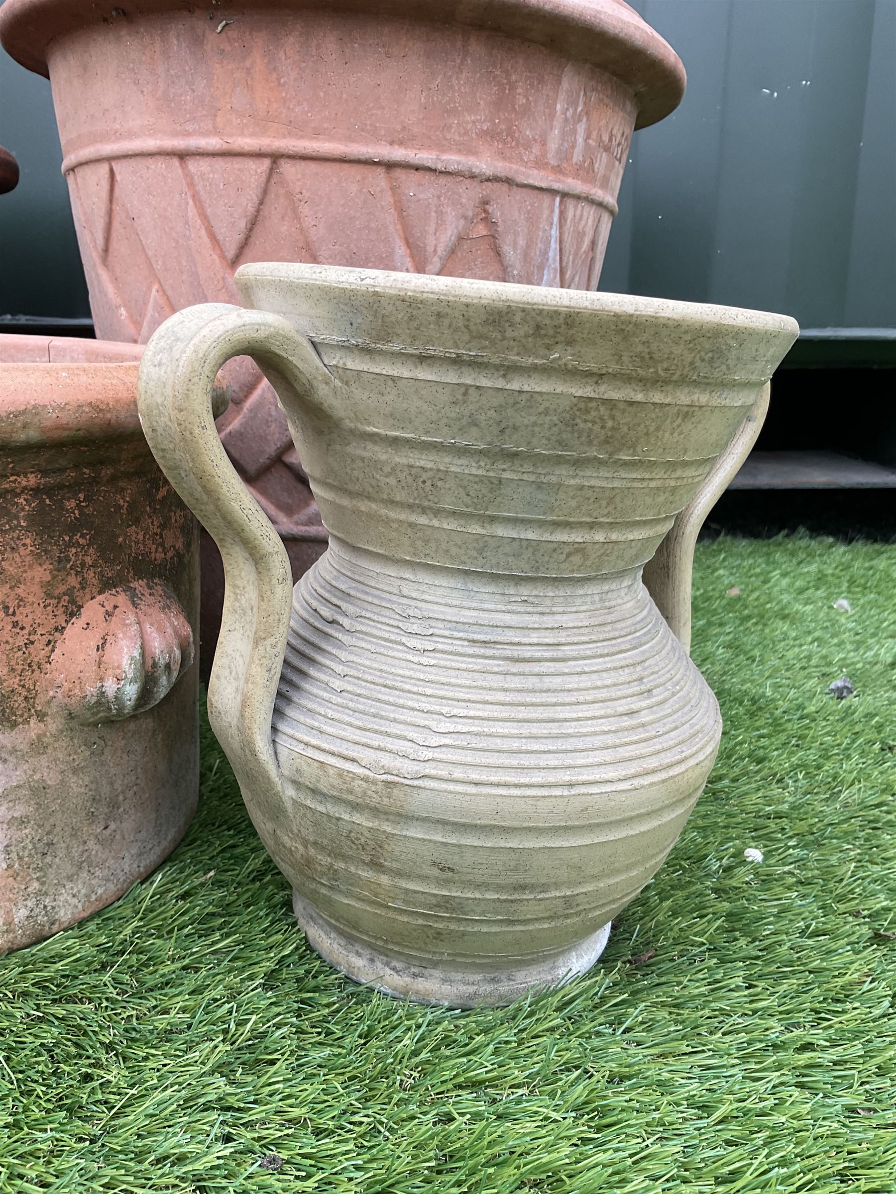 Set of six, terracotta, one glazed, one painted, plant pots, and two