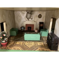 Large Tri-ang No.93 doll`s house in the 'Stockbroker's Range' c1935; two-storey double-fronted Tudor design, half timbered gables, two-storey bay windows, cream and mock shrubbery to front, opening metal framed windows with green shutters, red simulated tiled roof with chimney, integral garage with opening doors, front elevation has four hinged doors opening to reveal two bedrooms with fire places, living room, bathroom and kitchen with built in dresser and sink, entrance hall and staircase, side entrance with porch and seat and sun dial over on chimney stack; some wiring for electrical lighting; metal Tri-ang Toys disc verso; comprehensively furnished H66cm L117cm D43cm