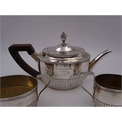 1930s American silver three piece batchelors tea service, comprising teapot, twin handled open sucrier and milk jug, each of part fluted oval form, the teapot with personal engraving to body, wood effect handle and silver urn shaped finial, stamped sterling with maker's mark for Gorham, teapot H13cm