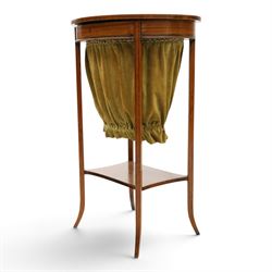 Edwardian inlaid satinwood oval sewing or work table, crossbanded and ebony-strung hinged top enclosing fitted compartment and olive-green upholstered well, raised on square tapering splayed supports united by under-tier 