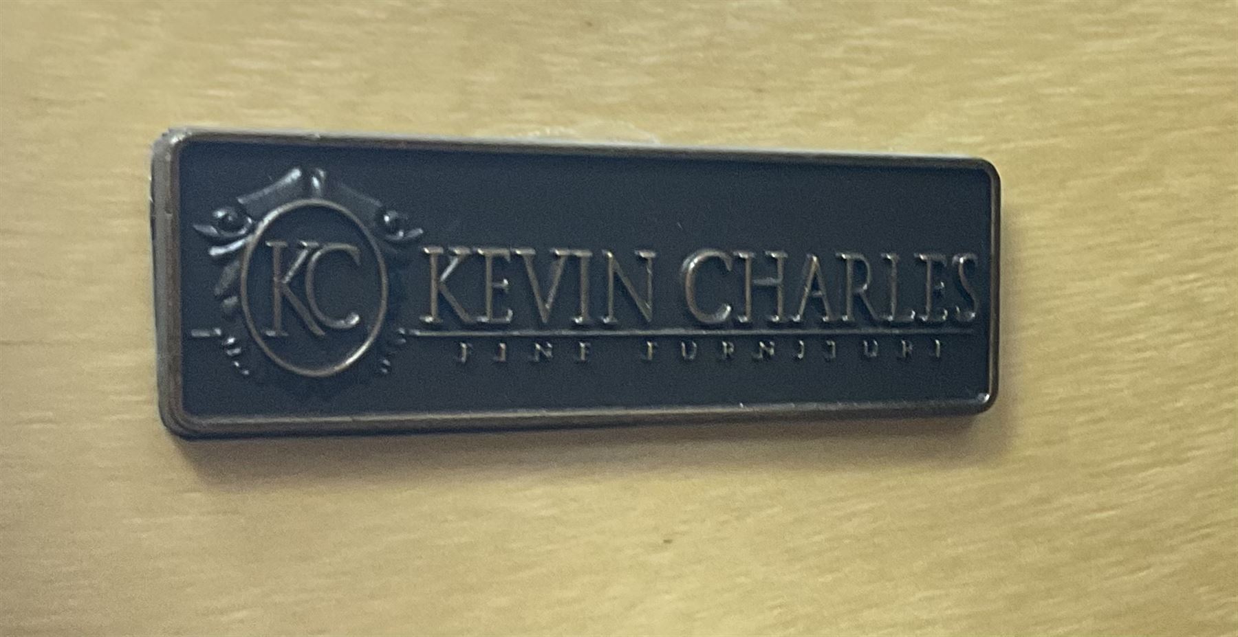 Kevin Charles American walnut serpentine chest, five graduating drawers, half turned fluted column carving, turned supports 