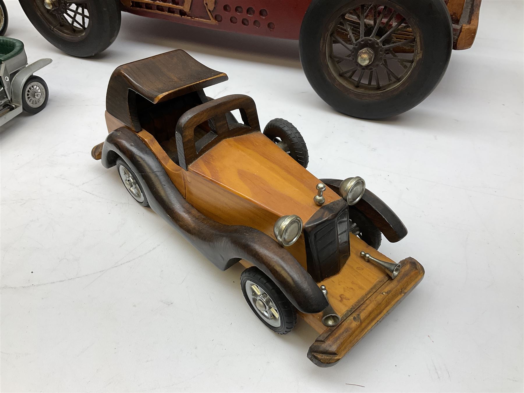 Four Franklin Mint Precision Models, one with hardwood body; large reproduction model of a vintage racing car L52cm; and four other modern metal/wooden models of vintage cars; all unboxed (9)