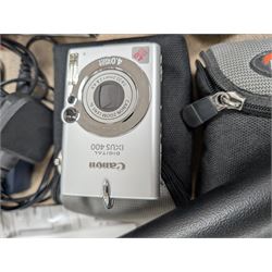 Two compact digital cameras, comprising Panasonic Lumix DMC-TZ3 digital camera, with Leica DC Vario Elmar 1:3.3-4.9/4.6-46 ASPH lens, with carry case, battery, charger, instructions and box and Canon Ixus 400 with carry case and instructions, Manfrotto Professional Tripod and a Benbo monopod