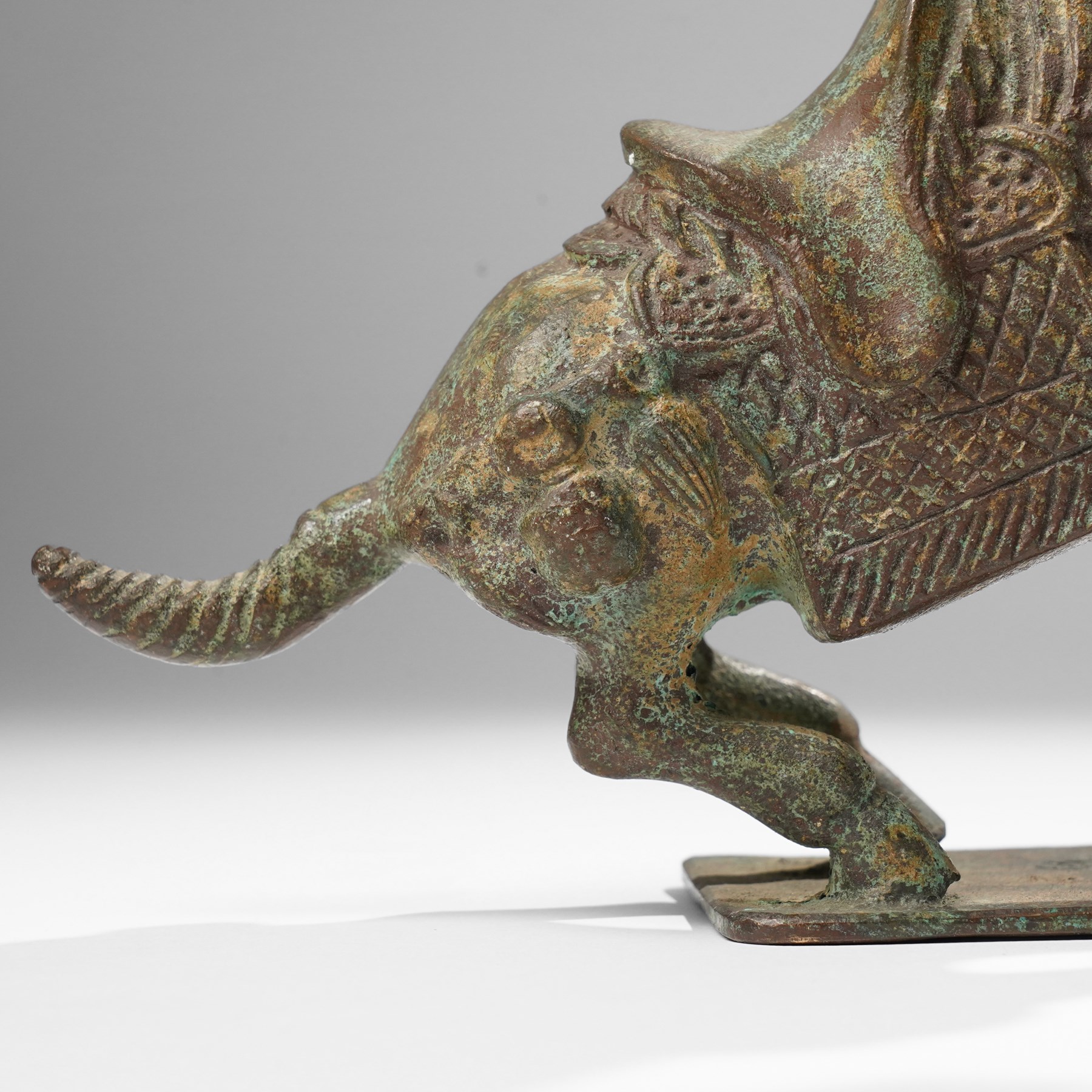 Chinese archaistic bronze wine vessel, Shang dynasty style but 20th century, W25cm; together with a Tang dynasty style model of a rearing horse, H17.5cm (2)