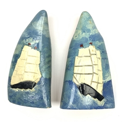Pair of sperm whale teeth, relief decorated and painted with three-masted whaling ships H14.5cm (2)
