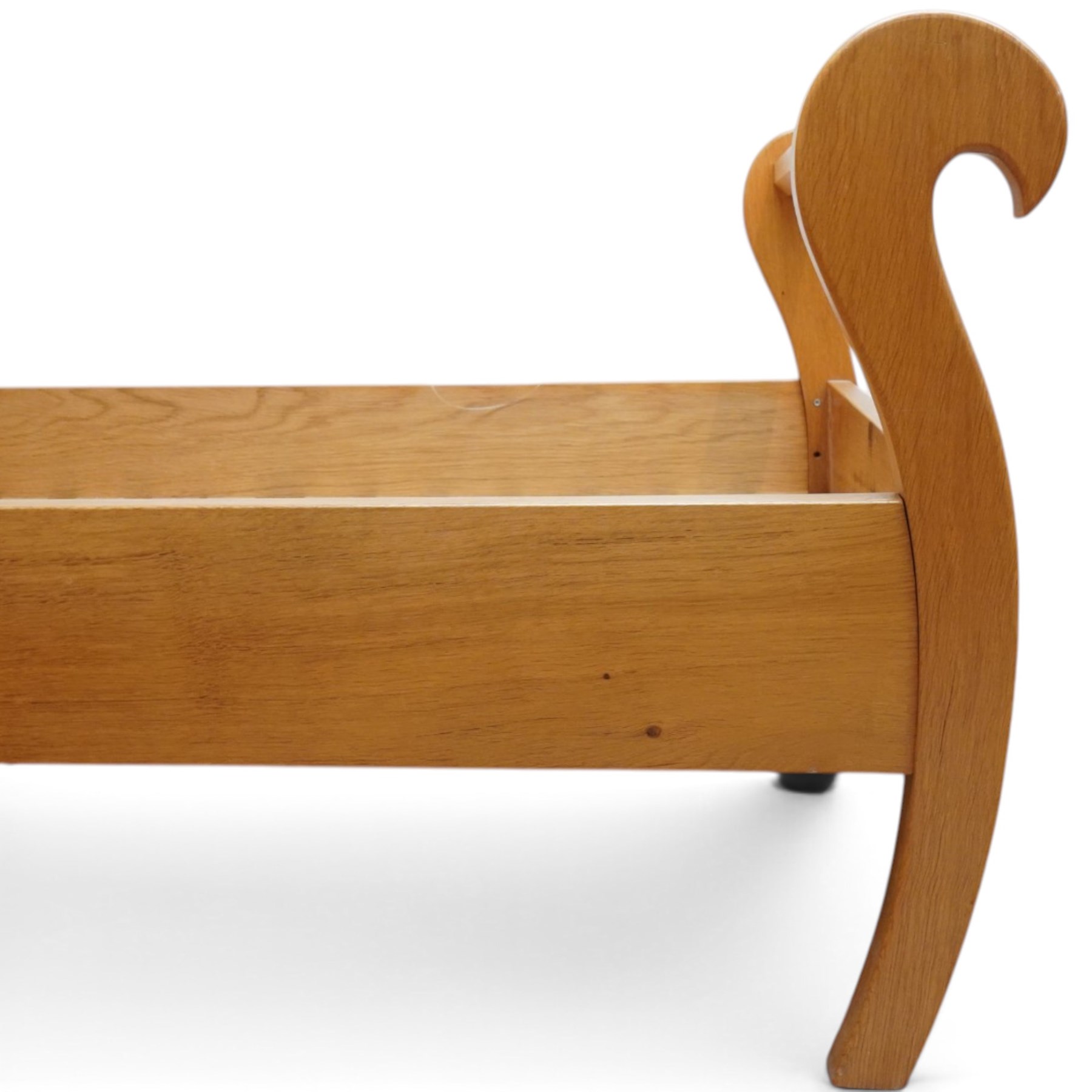 Unicornman - pair of craftsman-made oak single beds, of sleigh shape with scrolled head and foot-boards with octagonal stretchers, slatted base, raised on inward-splayed squared supports, applied with carved unicorn signature, by Geoff Gell of Coxwold