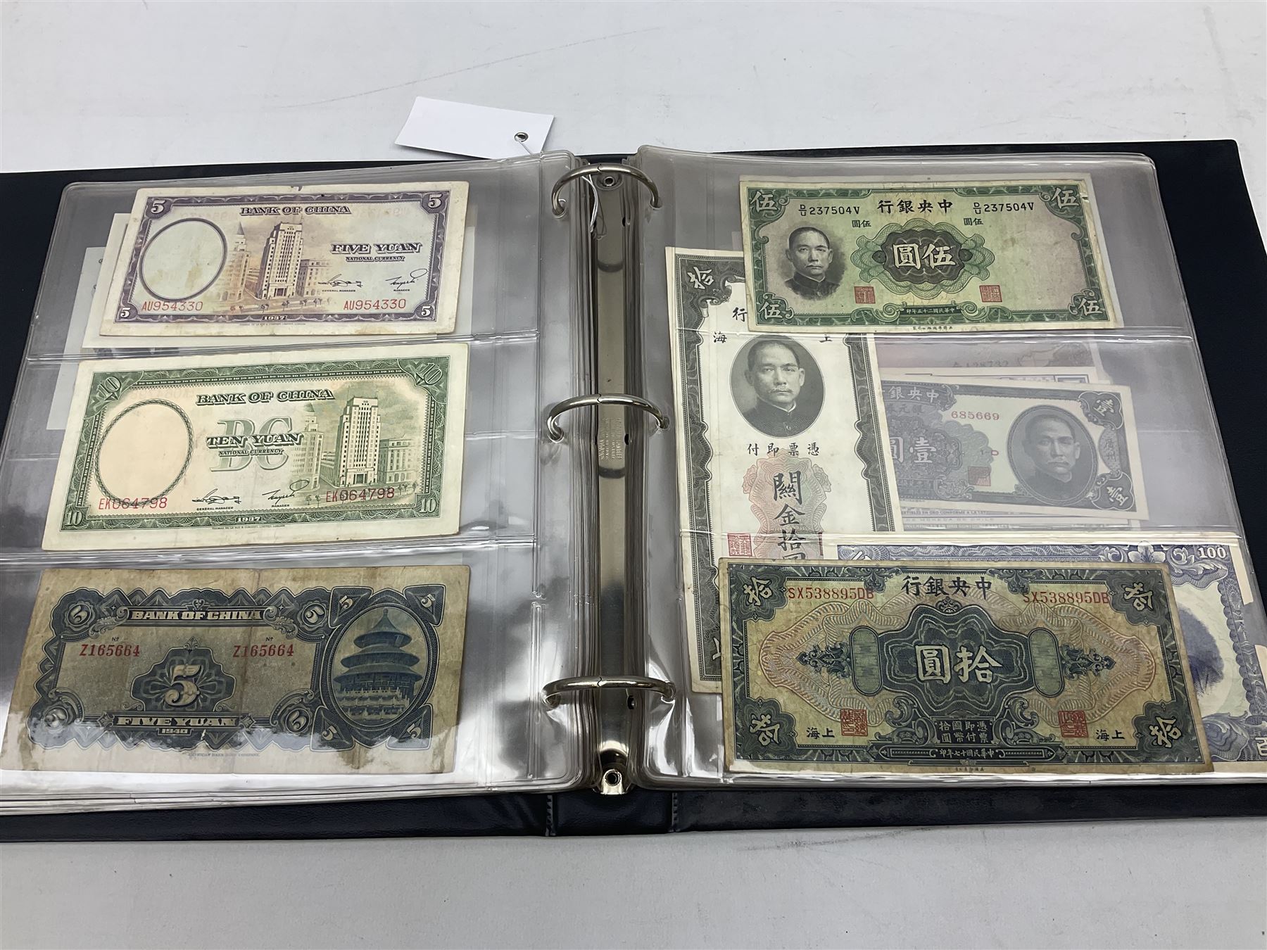 World banknotes, including Queen Elizabeth II The States of Jersey one pound 'DB202703', five pounds 'BB527762' and ten pounds 'AB651481', reserve bank of New Zealand two dollars '1L3 741894', King George V Straits Settlements one dollar 1st January 1935 'F/83 28924', various Bank of England notes etc, housed in two ring binder albums
