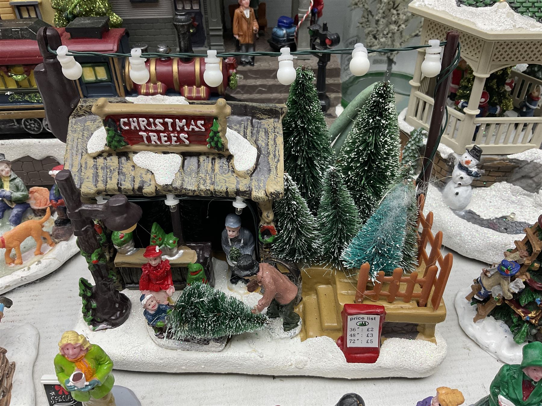 Christmas decorations; Premier LED Christmas Village scene with moving train, together with three Lumineo christmas scenes, and other similar 