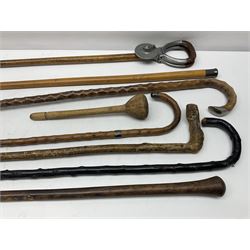 Six walking sticks, to include two hallmarked silver capped examples, together with a  shooting stick