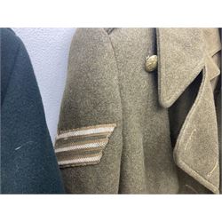 WW2 British female ATS Sergeant's service uniform grouping, consisting of four pocket female pattern service dress tunic with brass ATS shoulder titles and general service buttons; cloth lined interior with the original printed size label dated 1942; the matching khaki service dress skirt; and Greatcoat with size label dated 1945; together with army knitted sleeveless V-neck jumper; WRAC tunic, skirt and overcoat; full length cream and gold thread military evening dress by Hilliers Couture; and four webbing belts