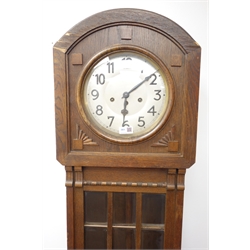  20th century arched top oak longcase clock, silvered Arabic dial with triple train movement, bevelled glass door, H180cm  