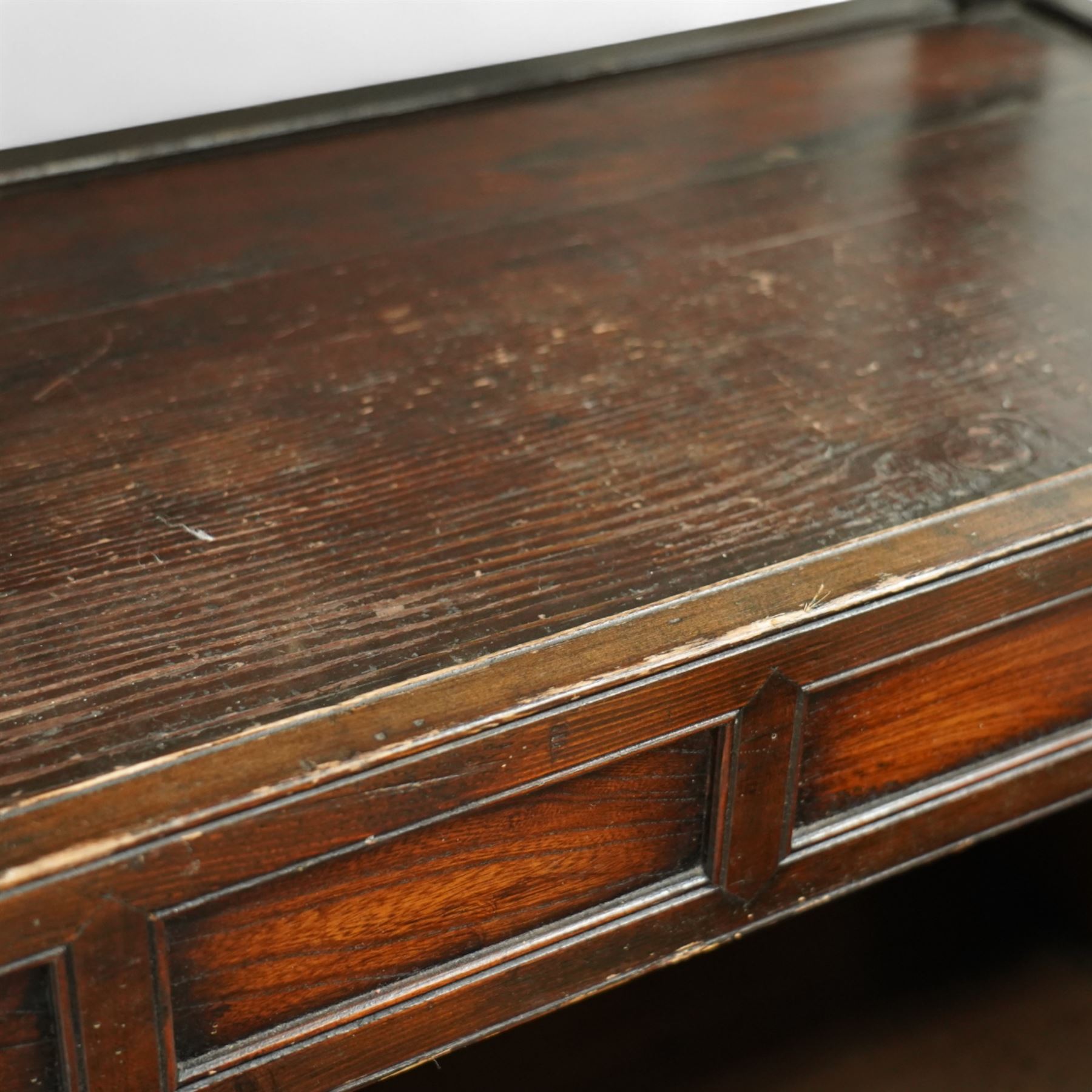 20th century Korean stained pine and elm cabinet, rectangular top over central panelled cupboard doors with metal ring handles, framed by geometric mouldings, open shelf above and below