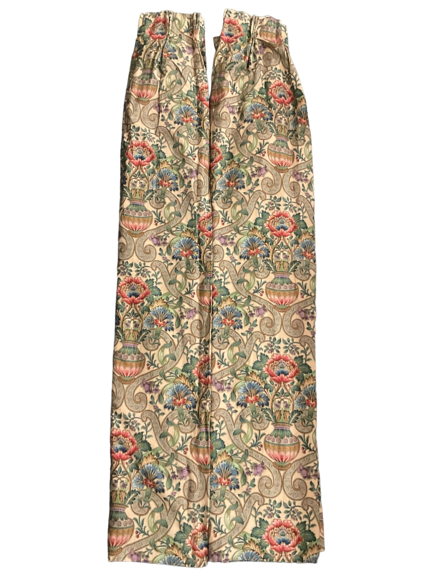 Two pairs of lined curtains, ivory ground fabric decorated with jardinieres of flowers spaced by scroll motifs, W329cm, fall 237cm (2)