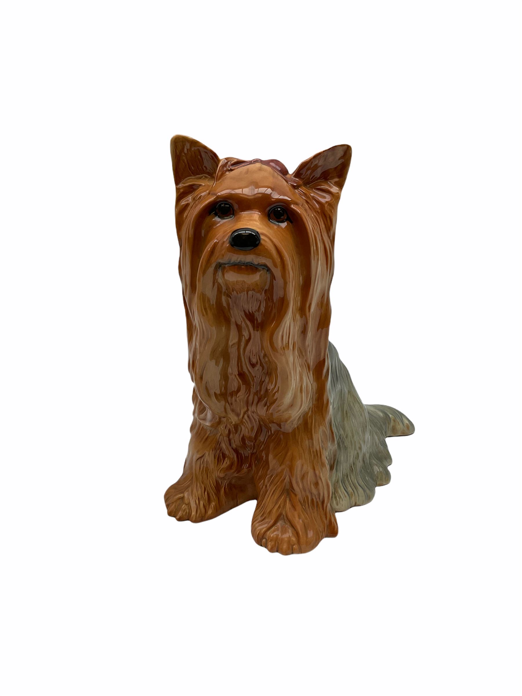 Beswick fireside Yorkshire terrier dog model no 2377 H25.5cm, together with a pair of staffordshire style white spaniels H30cm, two Mella ware terriers etc.  