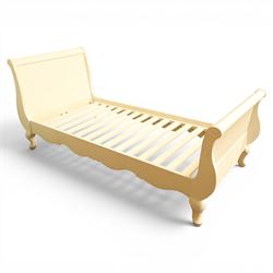 Modern white painted single sleigh bed frame and mattress, with scrolled head and footboar...