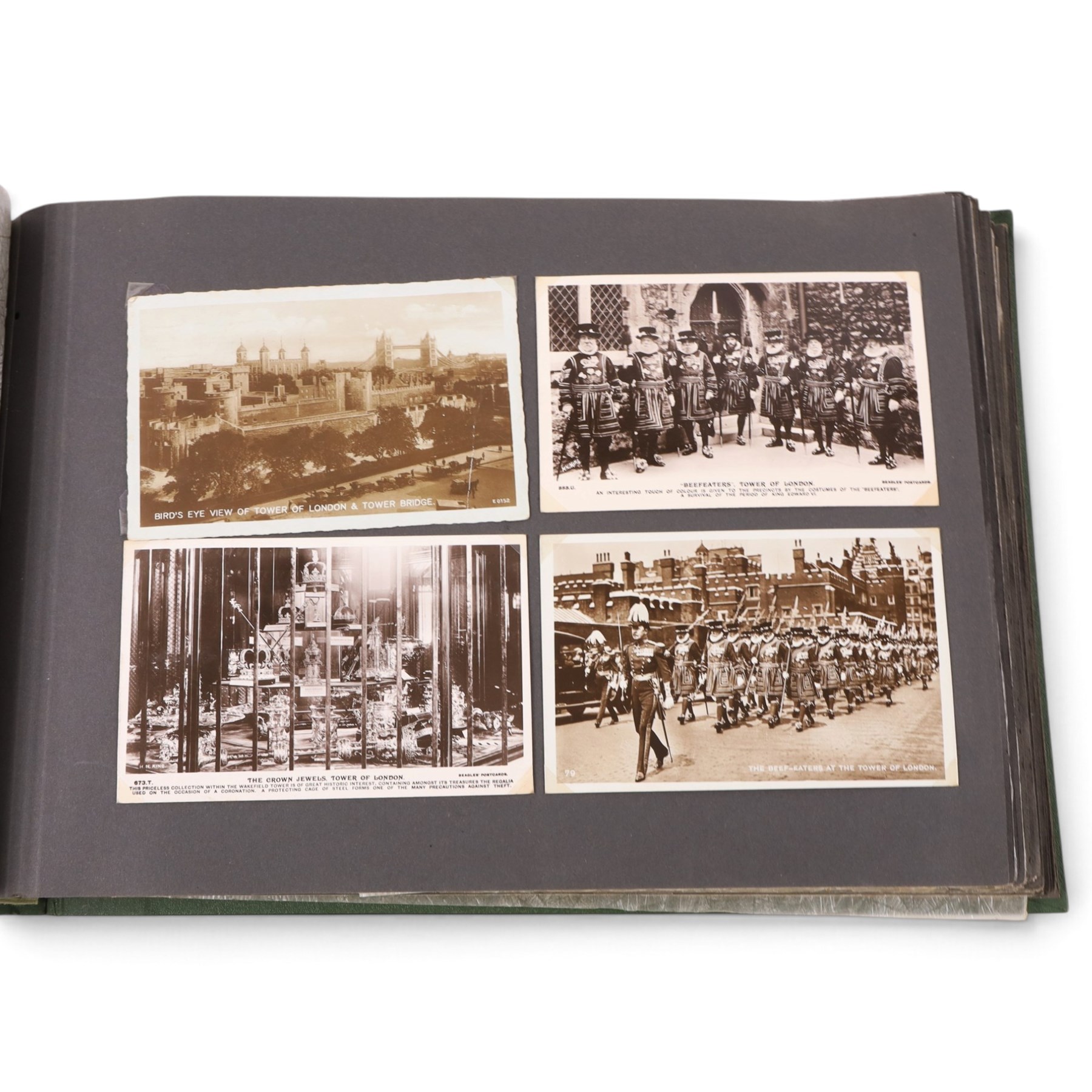 Two early to mid 20th century postcard albums, containing black and white and colour postcards, the first labelled Meine Reisen in Indien containing postcards of Arabia, India, Egypt, some personal photographs and newspaper clippings, of postcards, the second labelled Meine Reisen in England, containing mostly postcards of London, some greetings cards etc
