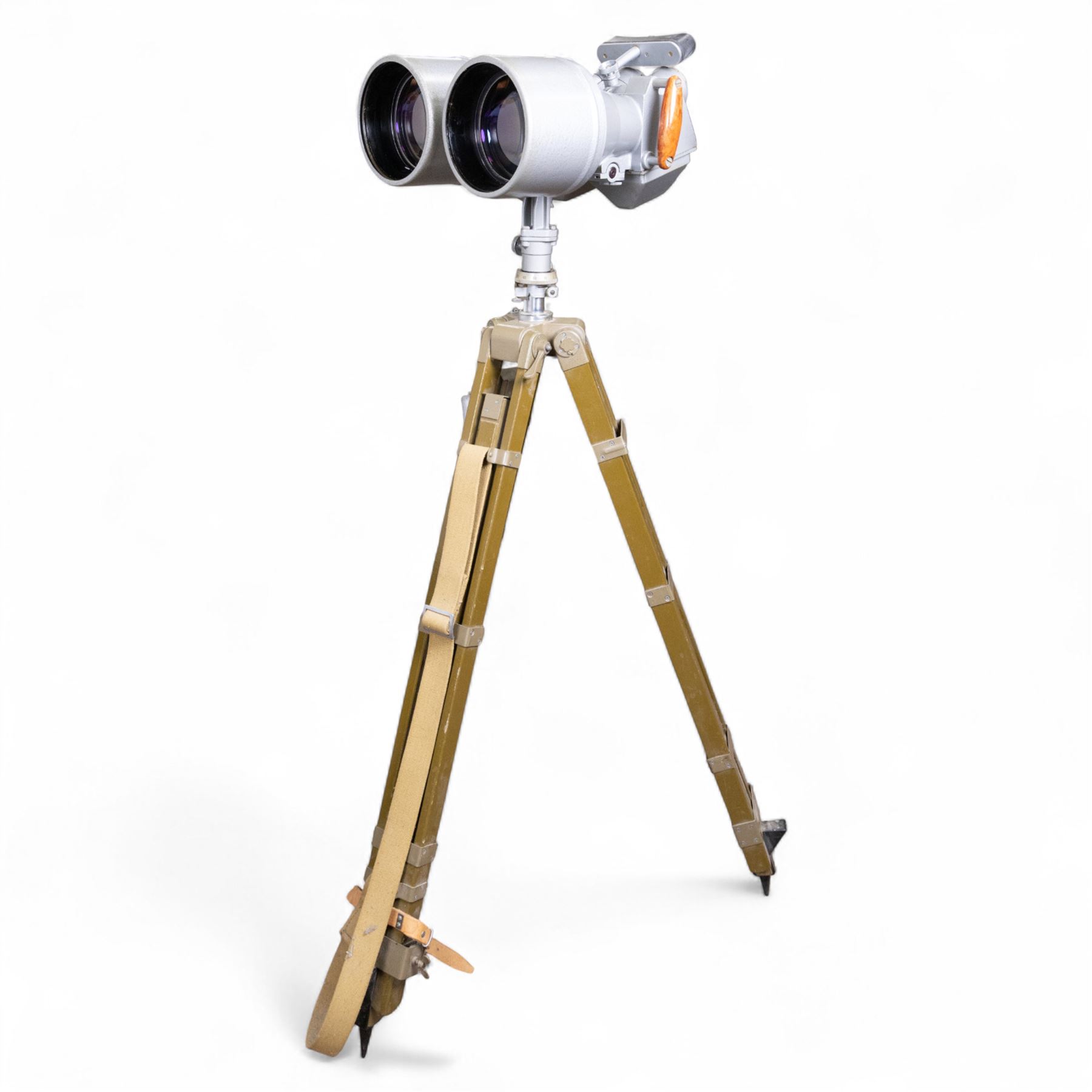 Pair of mid 20th century Russian Helios PNB-2 military observation binoculars, no. 40149, each 'Big Eye' lens 13cm in diameter, with 80 degrees vertical elevation, 360 degrees rotation, spirit level to centre of body, contained in wooden stow case with service manual, canvas cover, two lens caps, a small latched metal tin containing lenses and accessories and on adjustable wooden tripod painted green with pointed feet,  with a small latched metal tin containing eight lenses and accessories