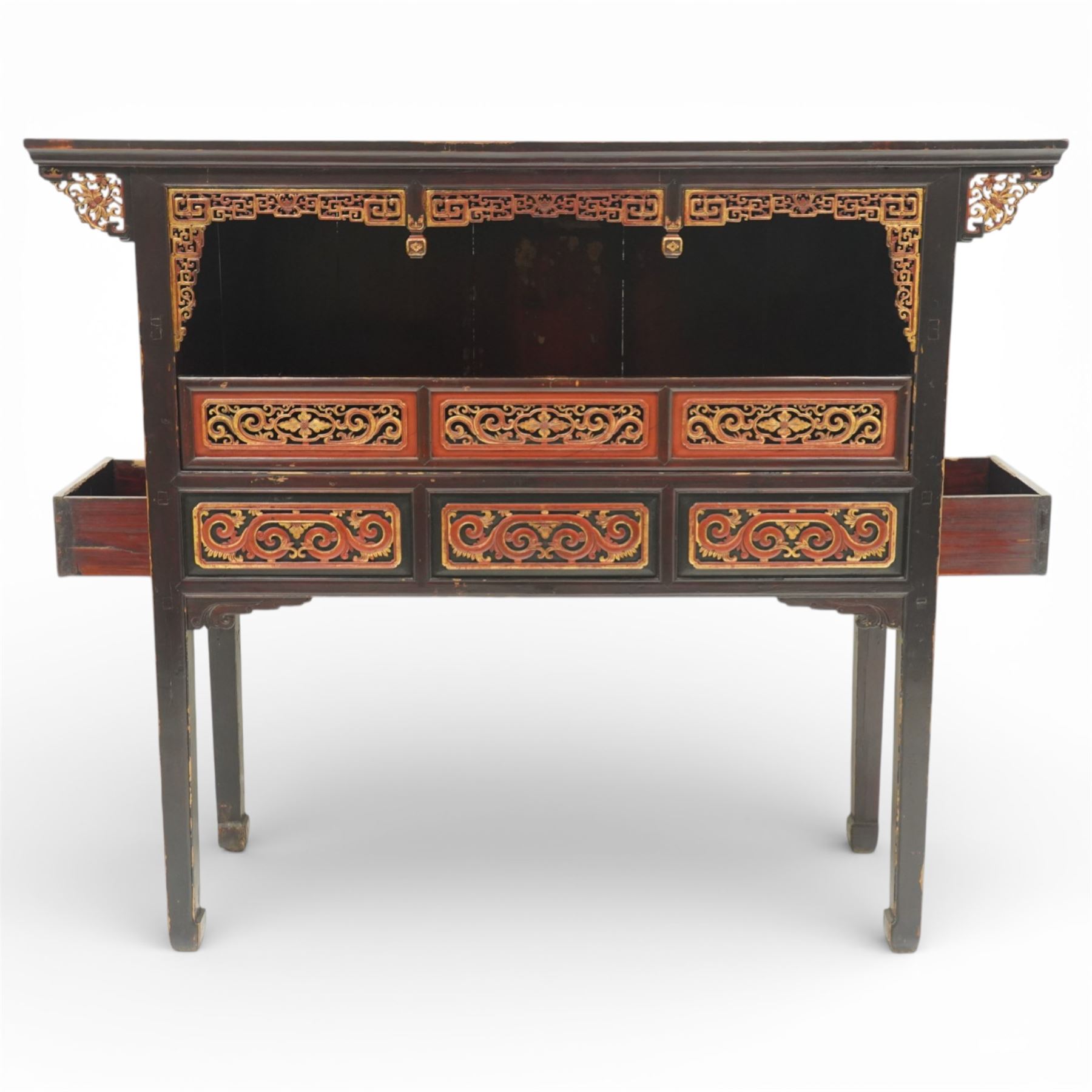 Chinese black lacquer Buddha cabinet, moulded top over open display recess framed by pierced geometric fretwork and corner spandrels, the base fitted with an arrangement of five drawers with carved and gilt scrollwork panels, on square supports with shaped apron brackets