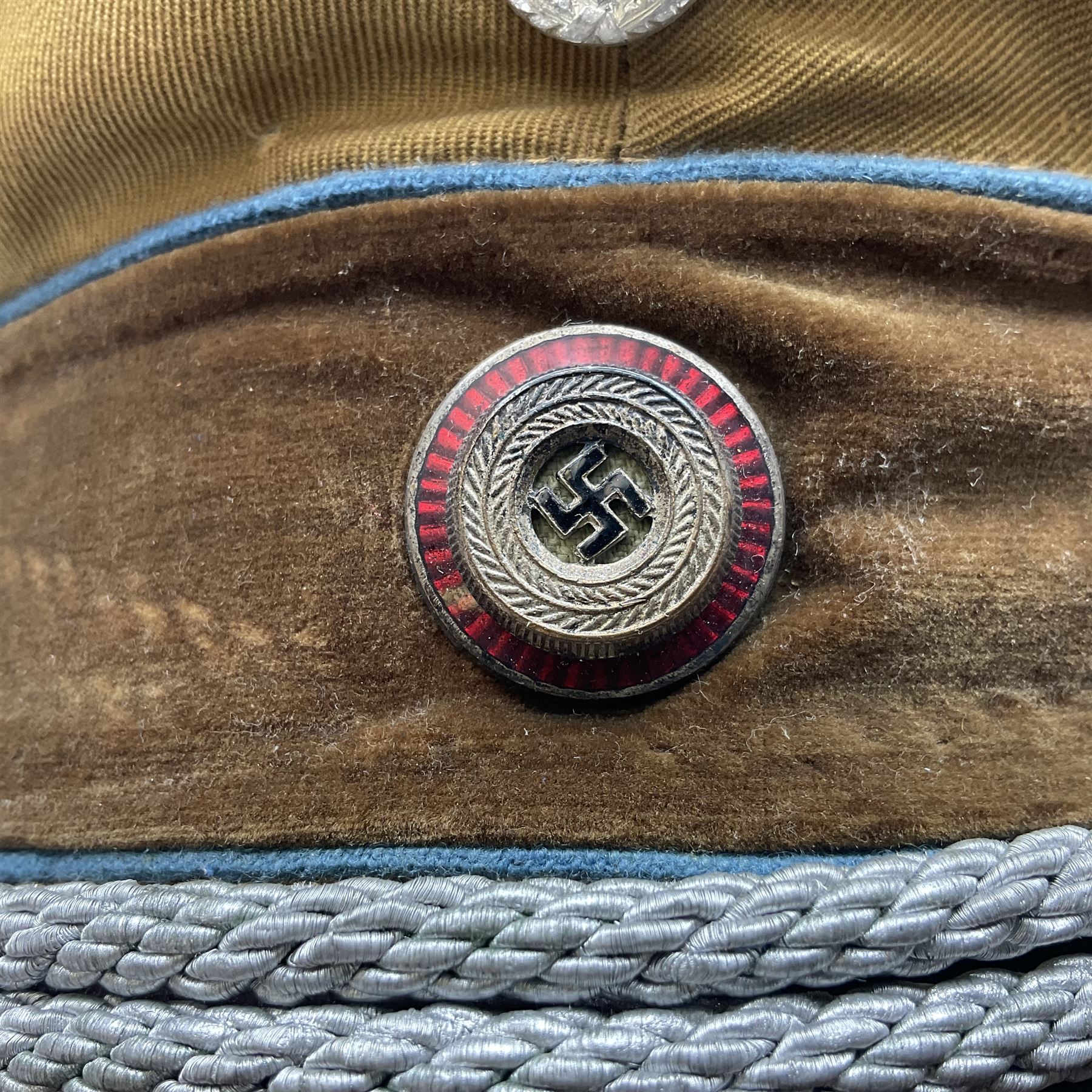 WW2 German Political Leaders brown cloth visor cap with metal insignia; labelled K. Hartel Weiden