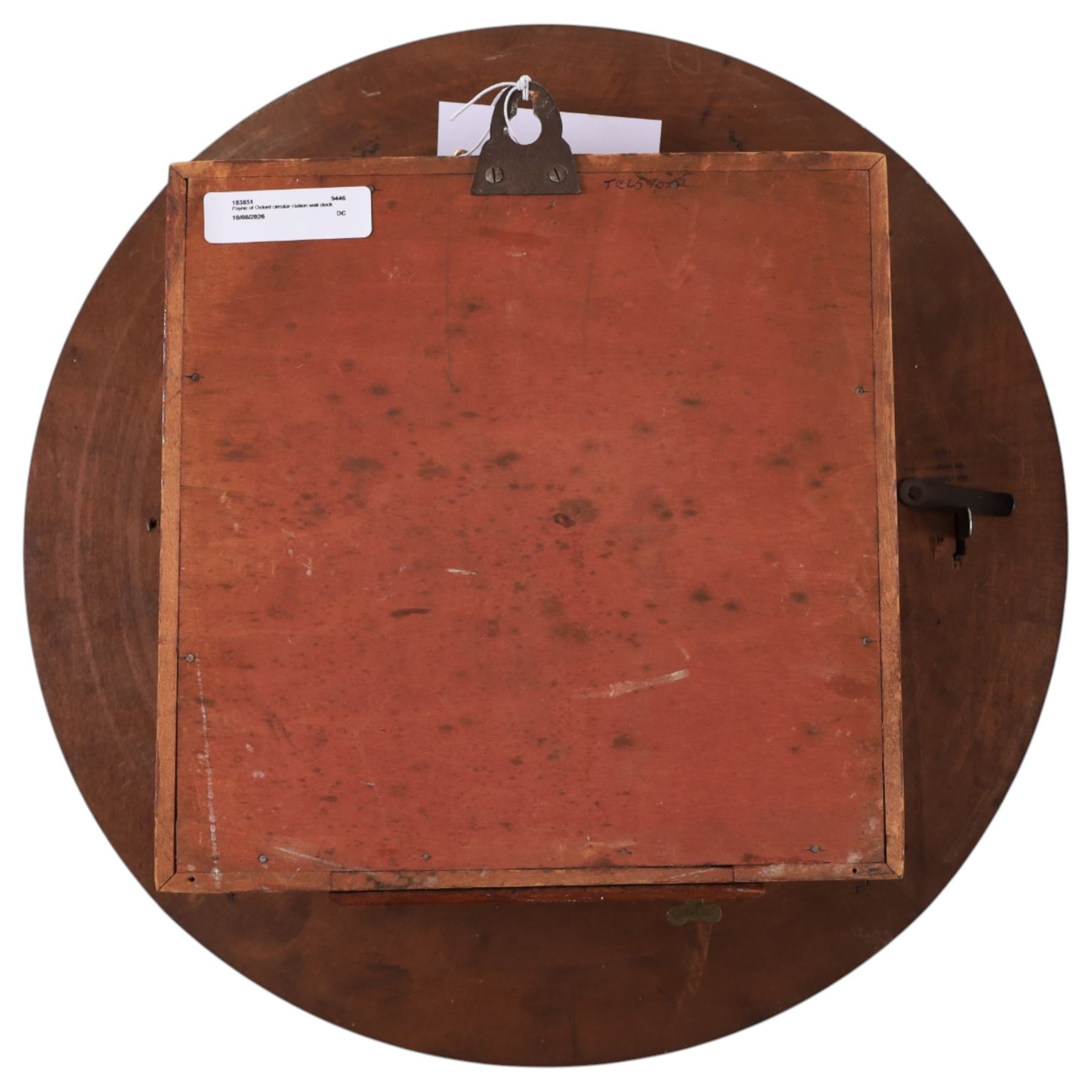 Payne of Oxford - early 20th century mahogany cased circular railway station wall clock, enamel dial with Roman numerals and single winding hole, with key