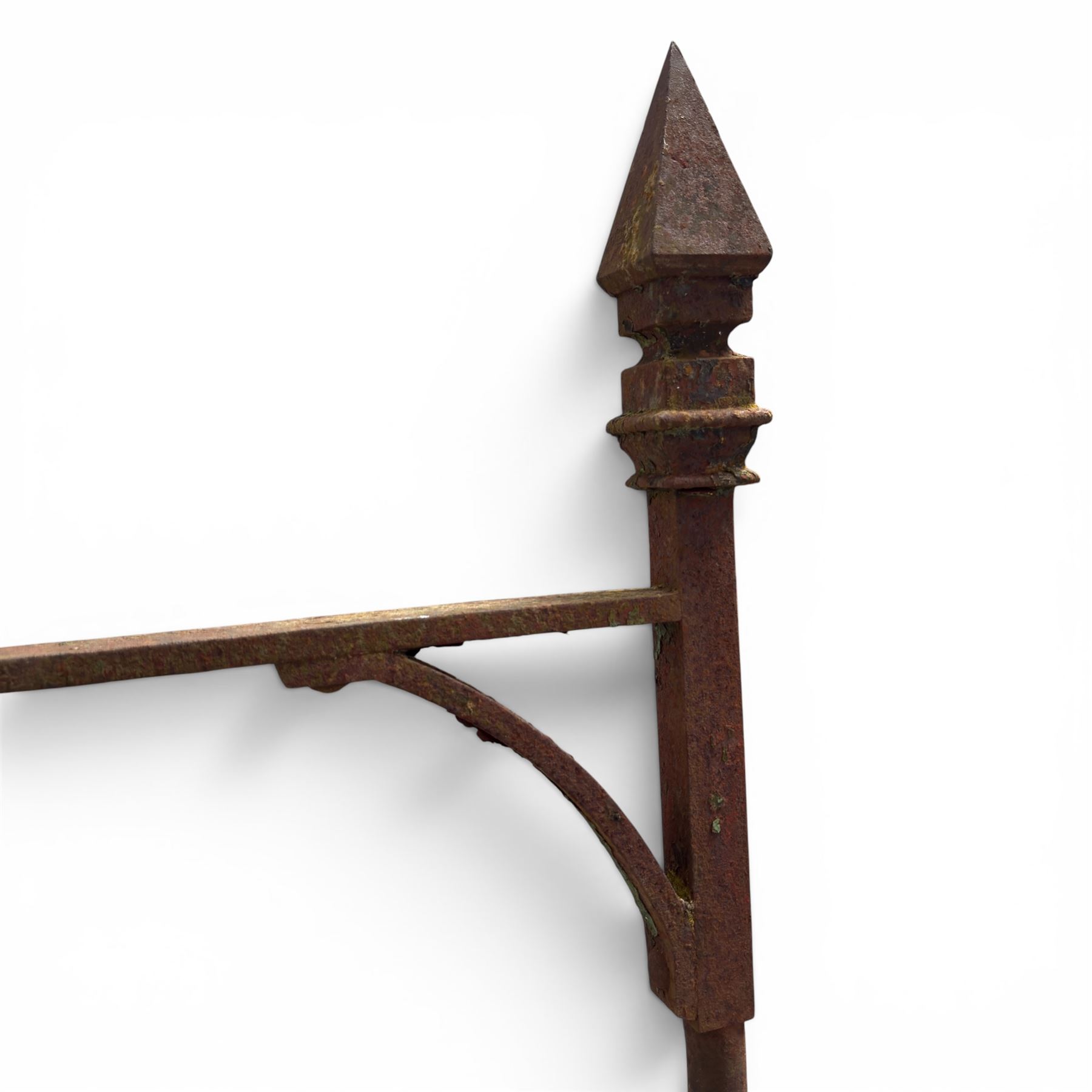 Georgian wrought iron single garden gate, pointed finial over strapwork cresting rail and arched profile with spearhead finials, the opposing side with scrollwork and hinged latch