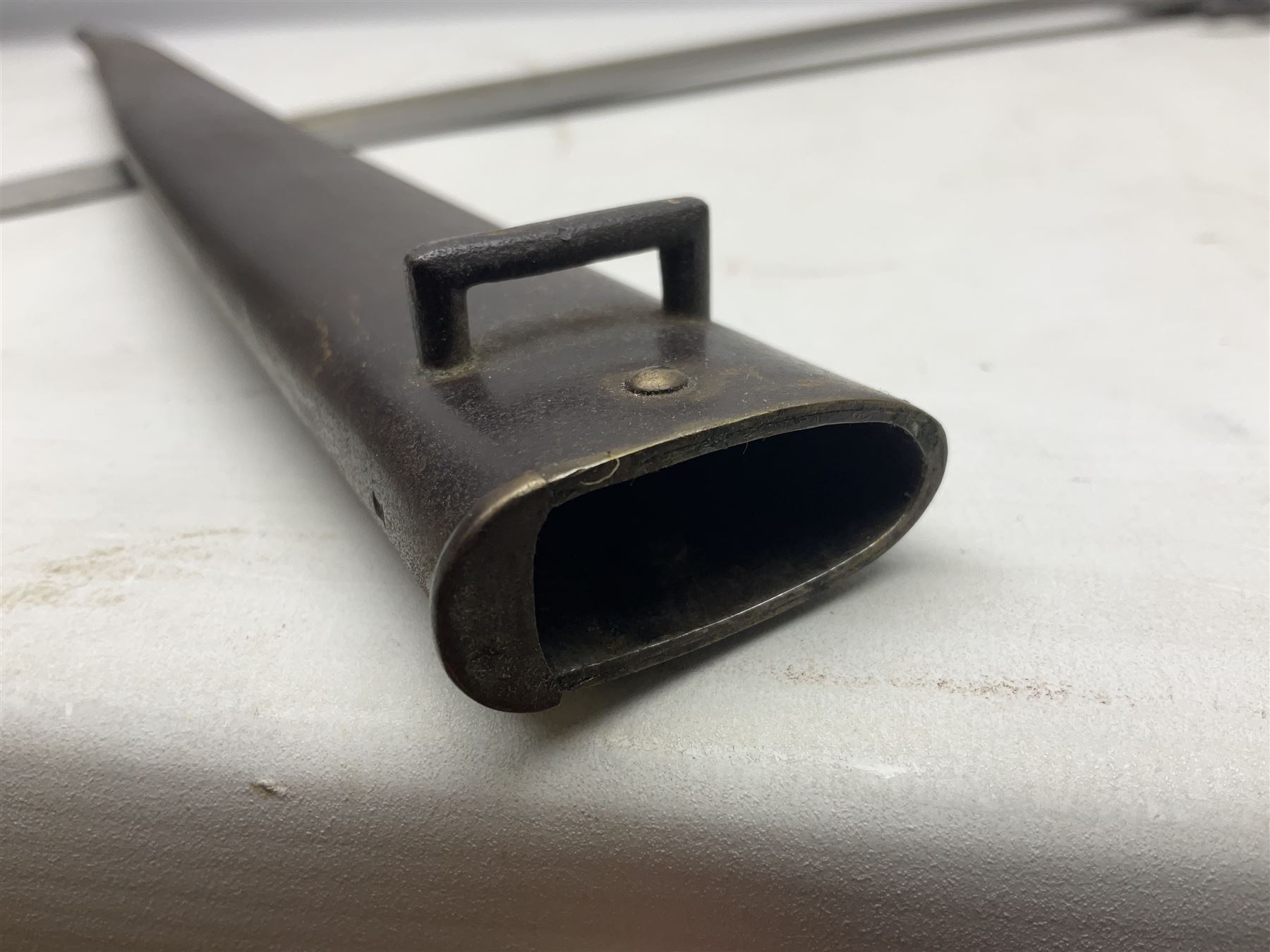 French model 1866 sabre bayonet, the 57.5cm curving blade marked St. Etienne 1868; in associated steel scabbard L71cm overall