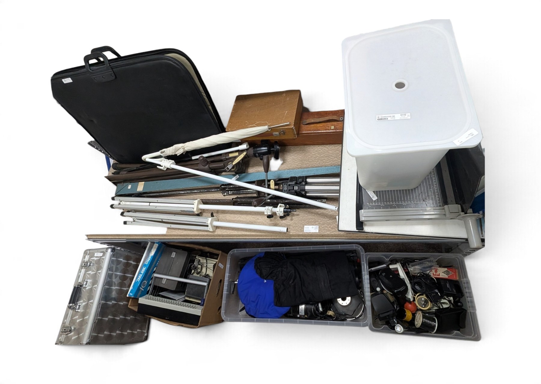 Collection of photography equipment, including cases, tripods, screens, guillotine, lighting etc