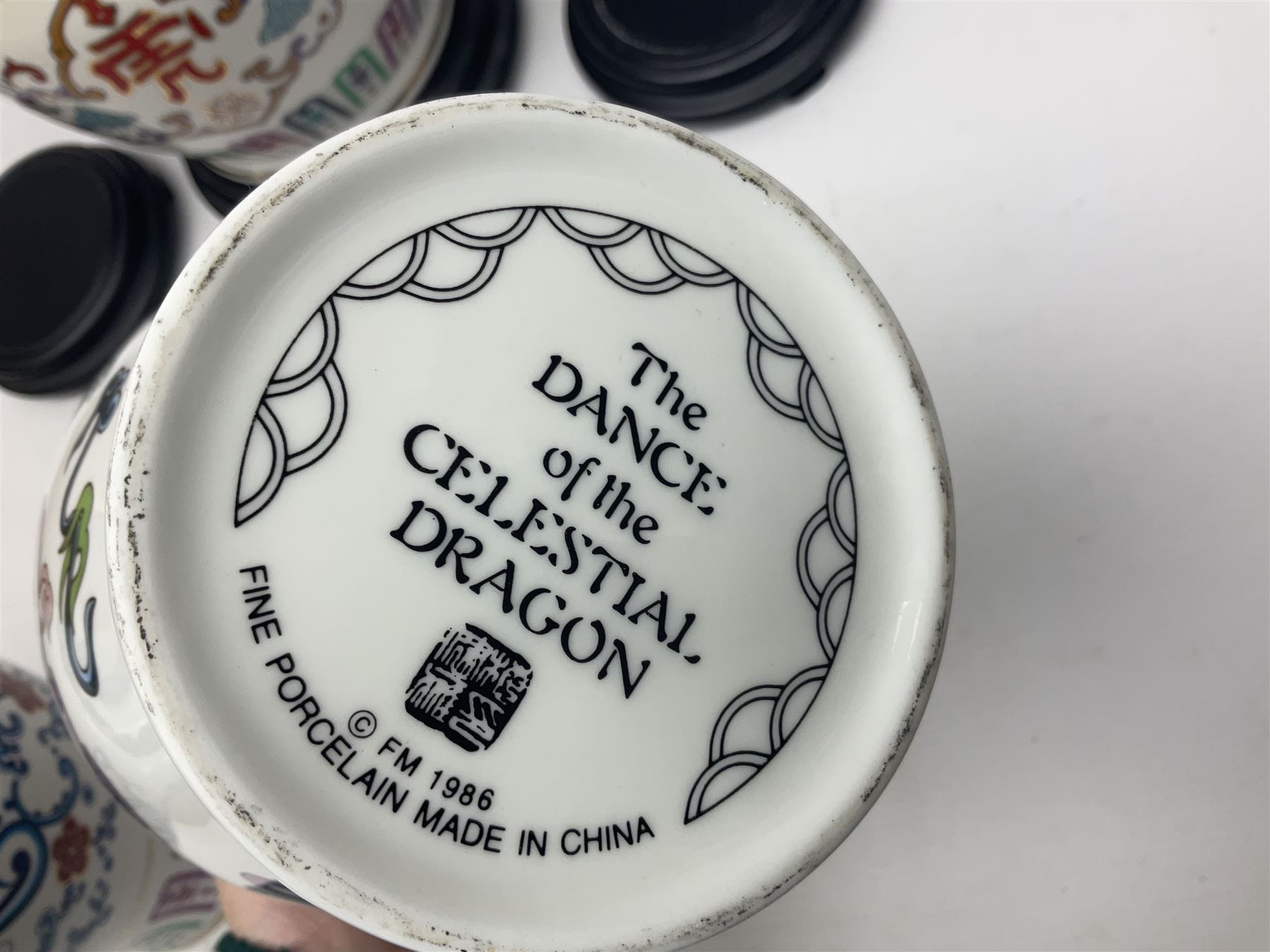 Franklin Mint Chinese style ceramics, comprising two vases, puppy and a planter, all on wooden stands