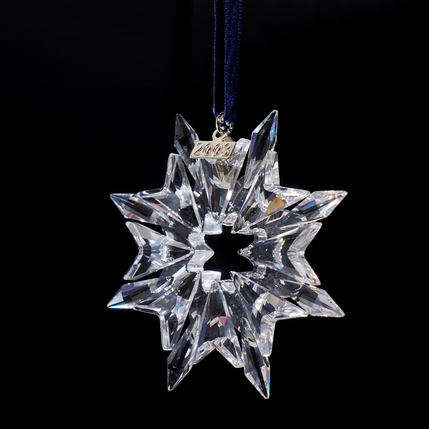 Nine Swarovski crystal snowflake Christmas ornaments, comprising years 1999-2005, 2010 and 2011, some with certificates, boxed (9)