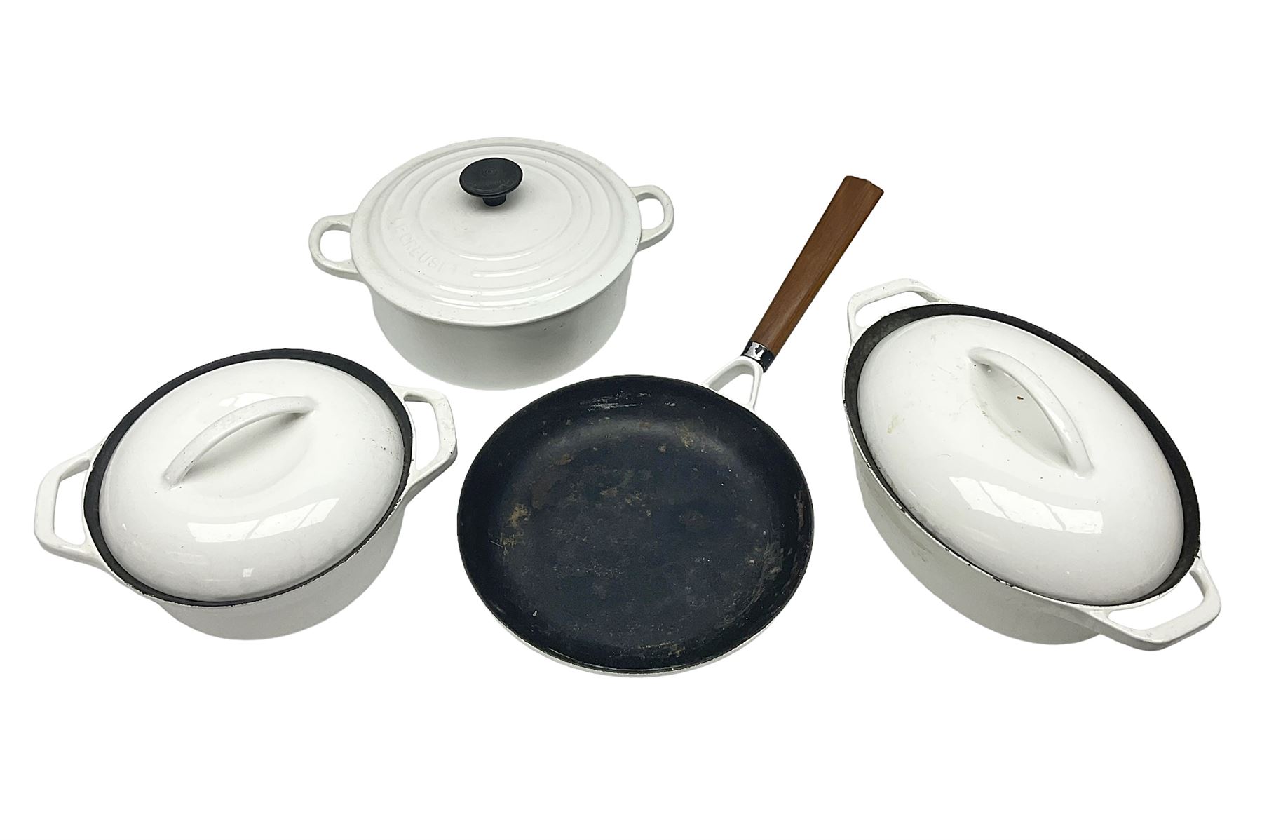 Le Creuset cast iron casserole dish, together with two Waterford cast iron dishes and a frying pan