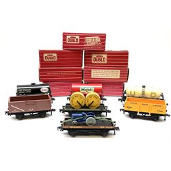 Hornby Dublo - 4646 Low-Sided Wagon D1 with cable drums; 4649 Low-Sided Wagon with tractor; 4656 16-Ton Mineral Wagon brown; 4657 United Dairies Milk Tank Wagon; 4660 U.G.B. Sand Wagon; 4677 Tank Wagon 'Mobil' (D1); and 4680 Tank Wagon 'Esso' (Fuel Oil); all boxed (7)