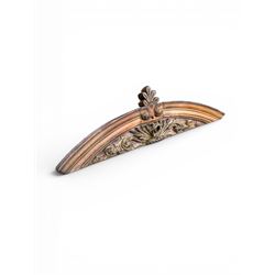 19th century carved pine architectural pediment, detailing floral swags with berries and central serpentine snake head 