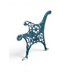 Pair of ornate painted cast iron bench ends, painted in green