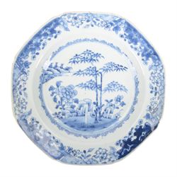 19th century Cantonese plate of octagonal form decorated to the centre with a garden of flowering peonies, together with two other 19th century plates and two serving platters each depicting temples in landscapes, octagonal plate W31cm  