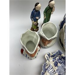 Two 19th century blue and white pickle dishes, each decorated in a variant of the Willow pattern, 19th century blue and white Willow pattern dessert dish, further Willow pattern dish, two black basalt jugs, small Victorian cockle dish, plus a group of Victorian and later figures, to include two Staffordshire arbour groups, one with beehive, Staffordshire style model of a sheep, two Sitzendorf monkey band figures, a Continental figure group modelled as a dancing couple, Atlas China figure of a Satyr, two jugs modelled as Punch and Judy, Rd no 139844, etc. 