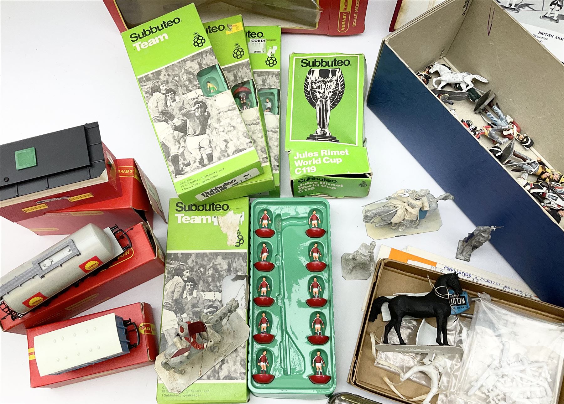 Fifty modern lead figures of mounted and foot soldiers, various period uniforms from 18th century to WW2, painted and unfinished with related paperwork; small quantity of Hornby '00' gauge model railway items and track; and four boxed Subbuteo teams etc