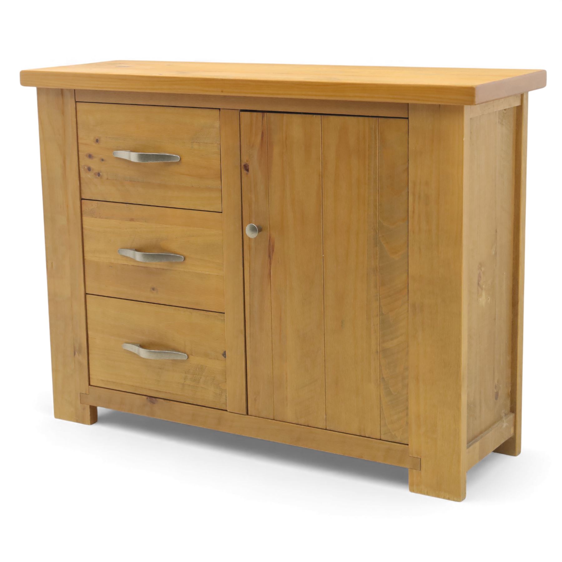 Contemporary pine side cabinet, rectangular top with moulded edge, fitted with three drawers with brushed metal handles alongside a single cupboard door with round metal knob, plain sides, raised on square block feet