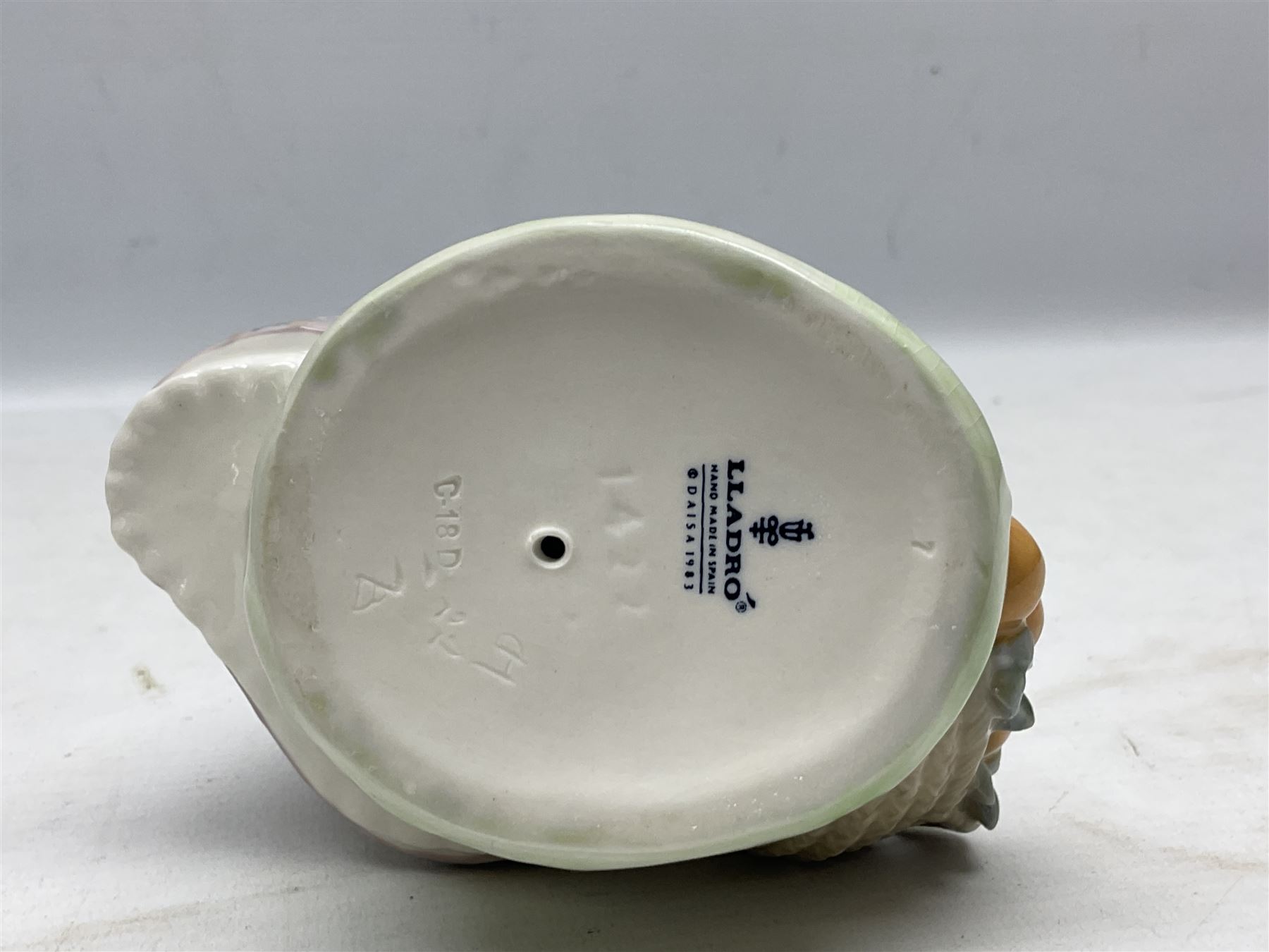 Lladro figure, Miss Valencia, modelled in traditional Valencian dress with basket of oranges, sculpted by Juan Huerta, with original box, no 1422, year issued 1982, year retired 1997, H18cm