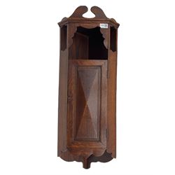 Early 20th century oak corner cabinet, enclosed by faceted panelled door (H89cm, W33cm), and a late 20th century mahogany bow front corner cabinet (H61cm, W33cm)