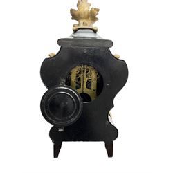 Ansonia - American late 19th century steel cased 8-day mantle clock in a Rococo case with decorative brass mounts, brass dial with Arabic numerals, steel hands and a repousse dial centre, twin train striking movement sounding the hours and half hours on a gong. with pendulum and key.
